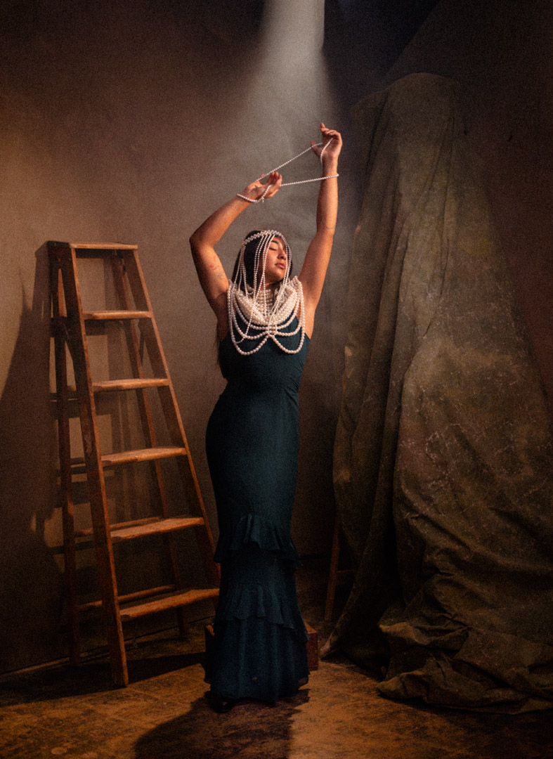 Studio portrait of a woman wearing pearls